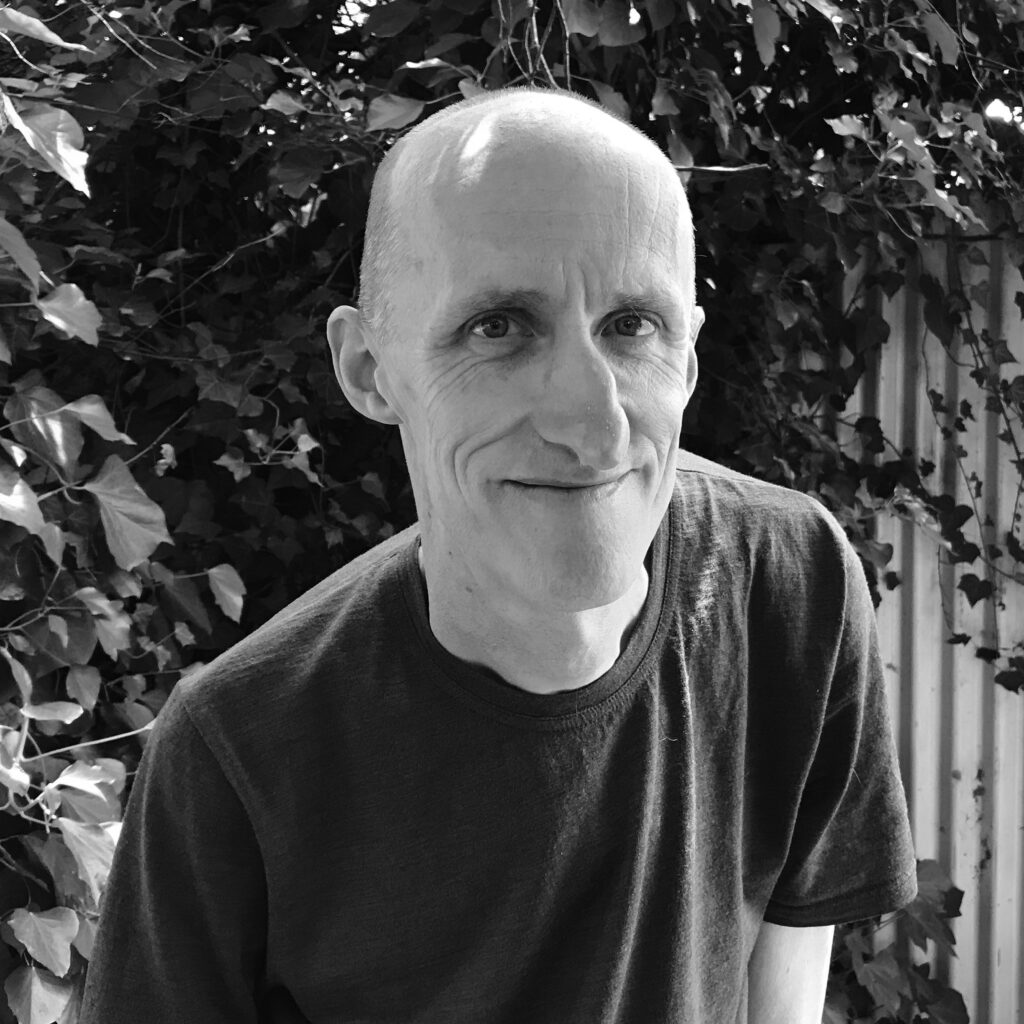 Black and white image of the poet and creative writing teacher, Andy Jackson.
